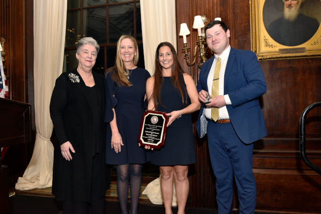 Photo of award and recipients